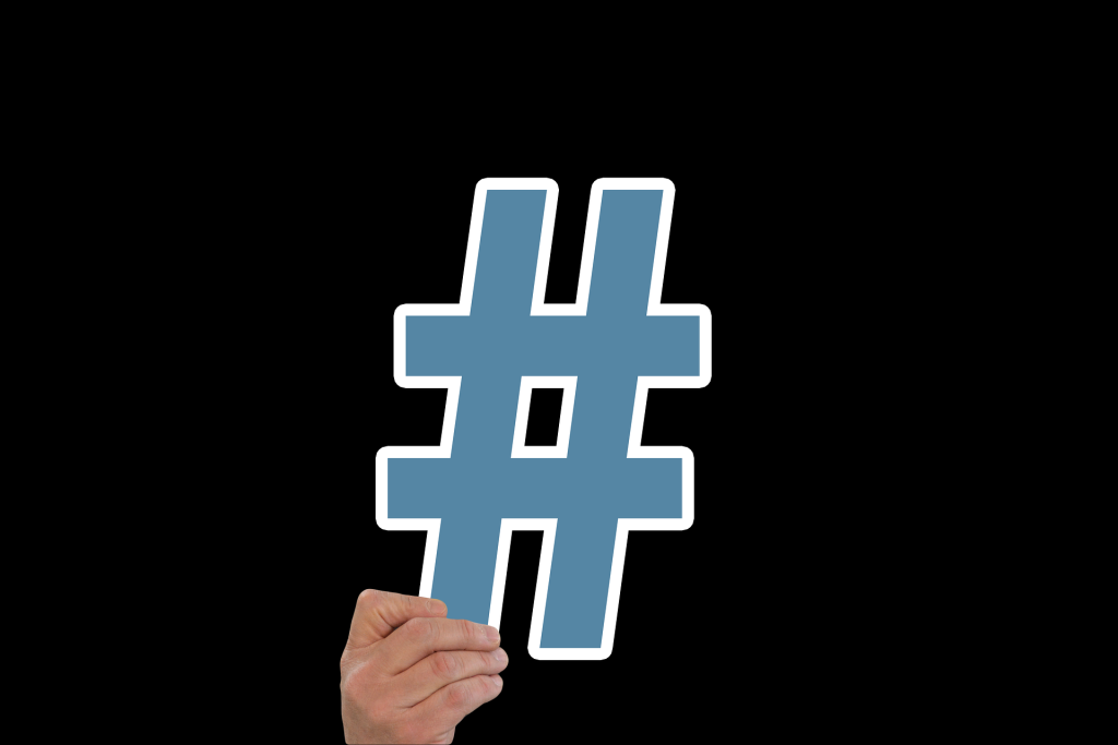 A person holding a hashtag 