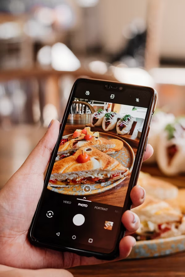 Food blogger is capturing food's image to post