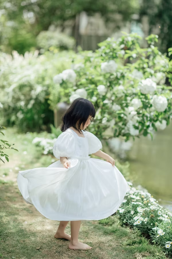 A little girl is frolicking in joy