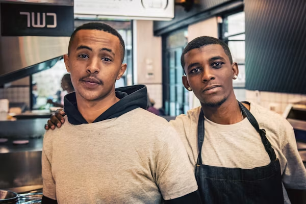 Two boys working in a restaurant