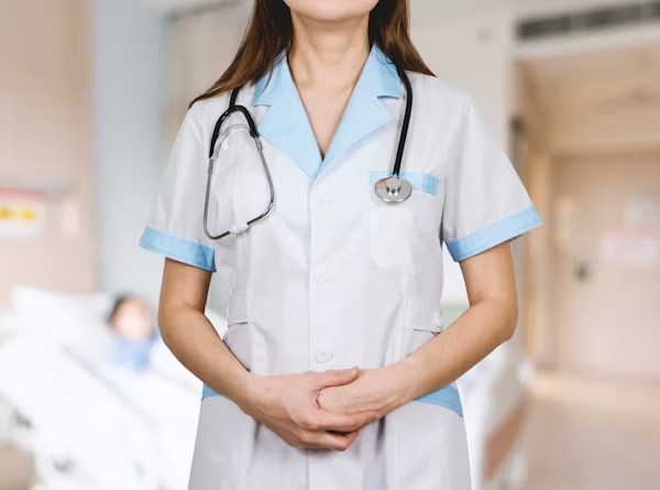 A graceful nurse is posing for a shot