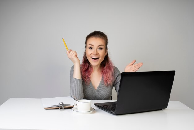 Excited writer thinking about what to write in their first blog post