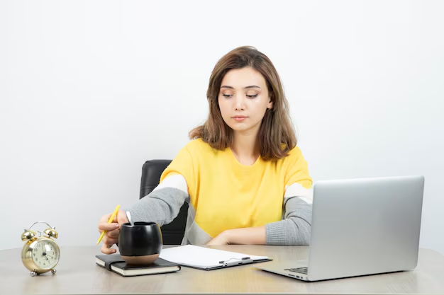 A young girl is writing blog posts