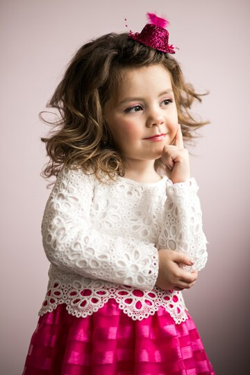 Little girl with a small pink hat